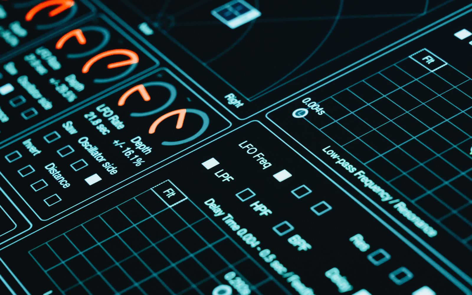 Foto em close de uma interface digital exibindo gráficos futuristas e análise de dados em baixa luminosidade