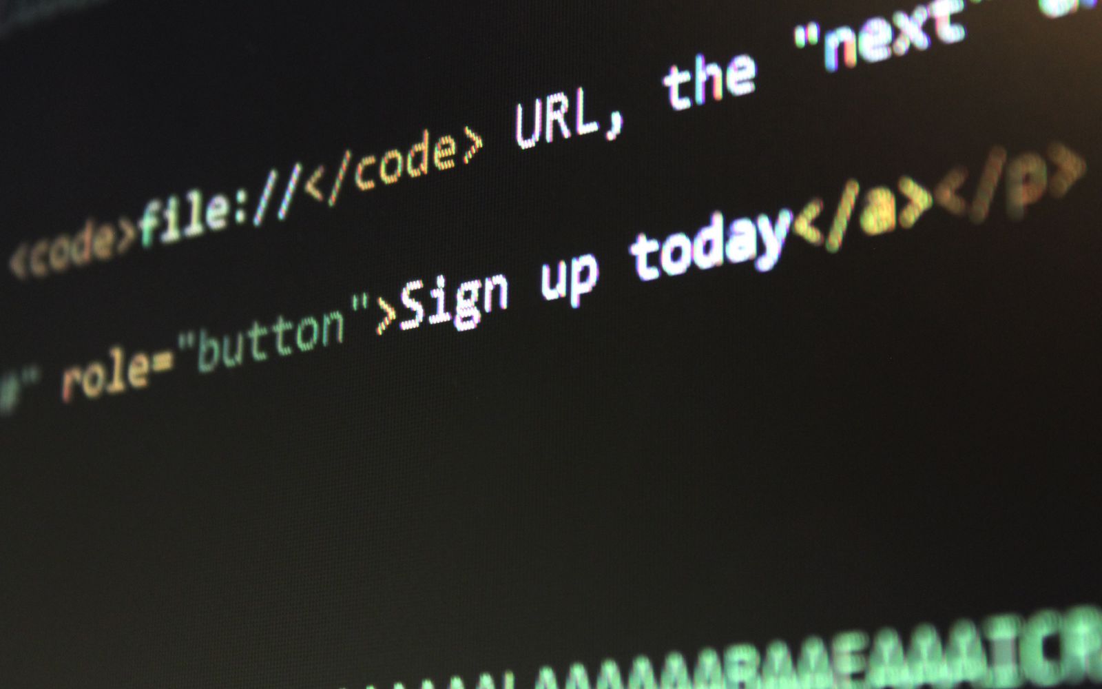 Código HTML e CSS na tela do computador